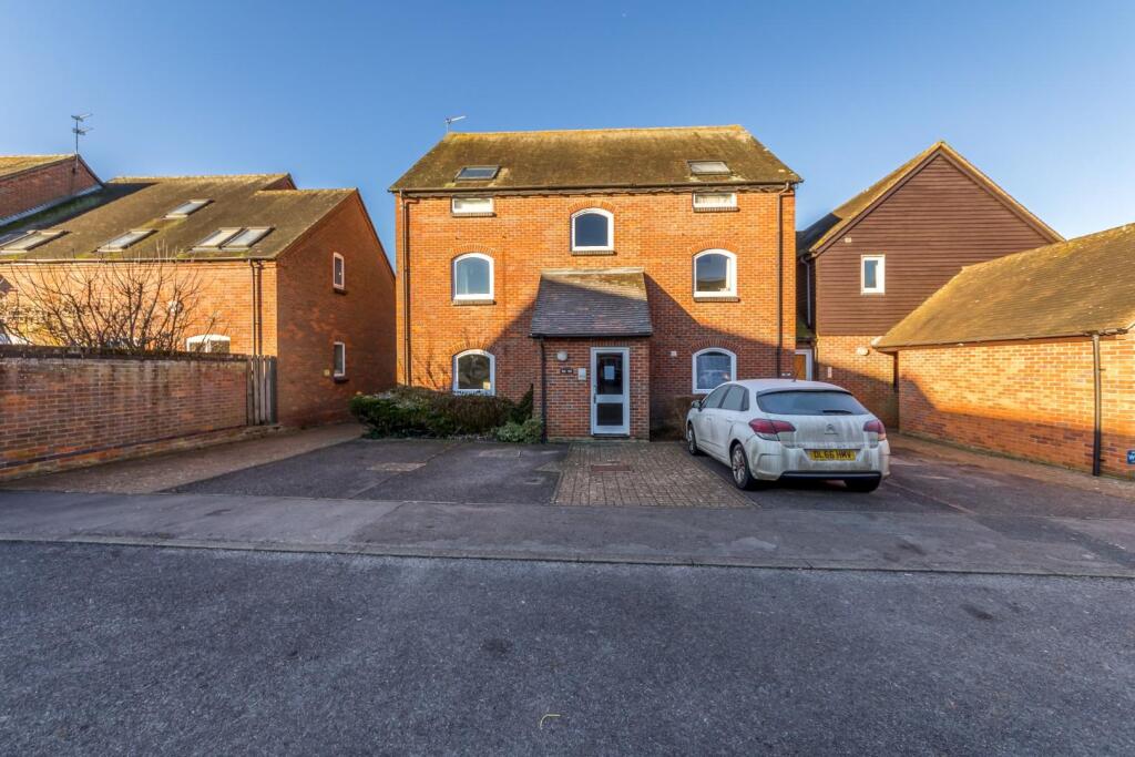 Front of building with 1 allocated parking space
