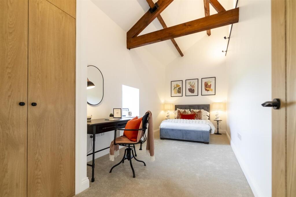 Vaulted ceilings and exposed beams in all the bedrooms