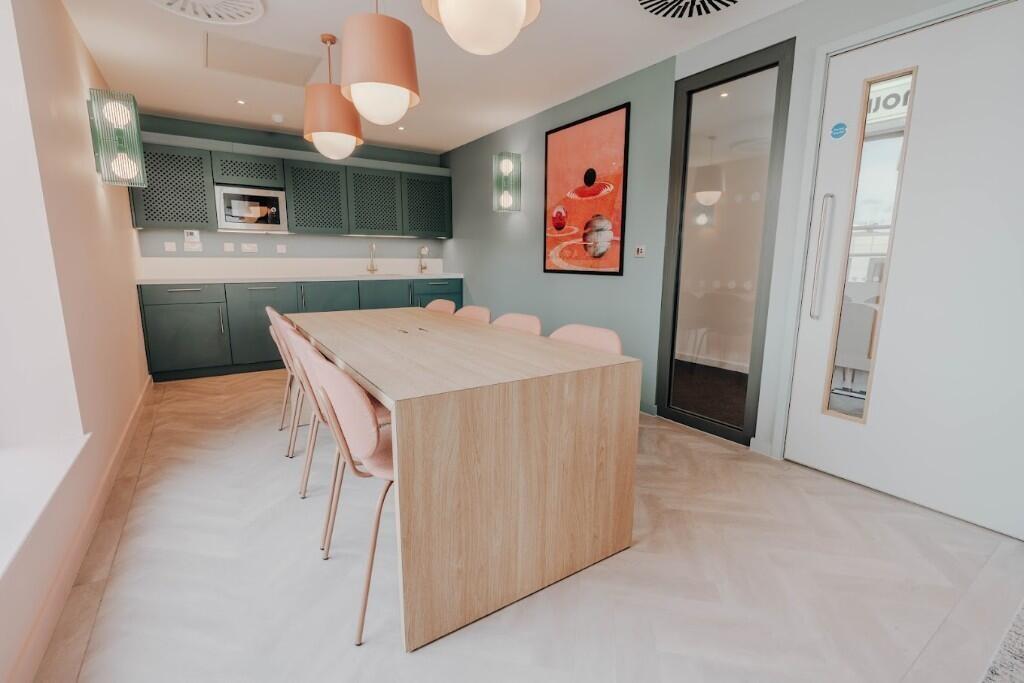 Bright and modern kitchen space featuring a sle...