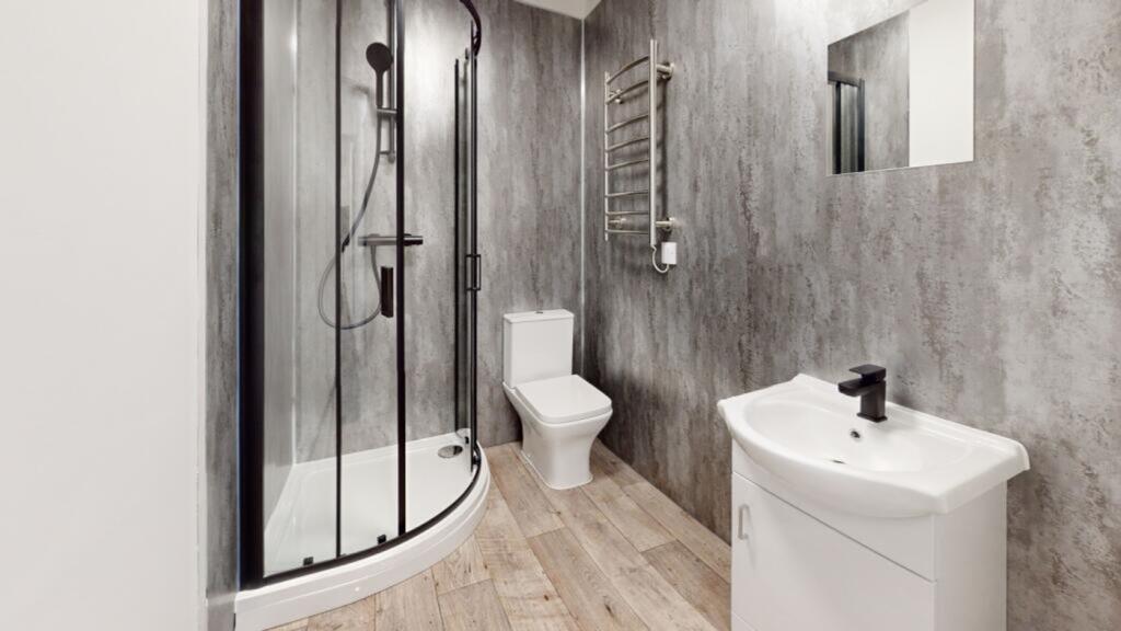 A modern and stylish bathroom featuring a sleek...