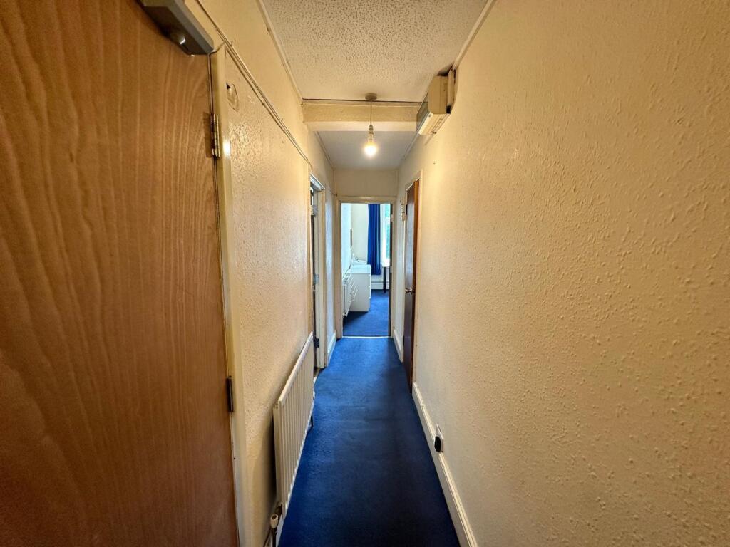 A well-maintained hallway providing access to v...
