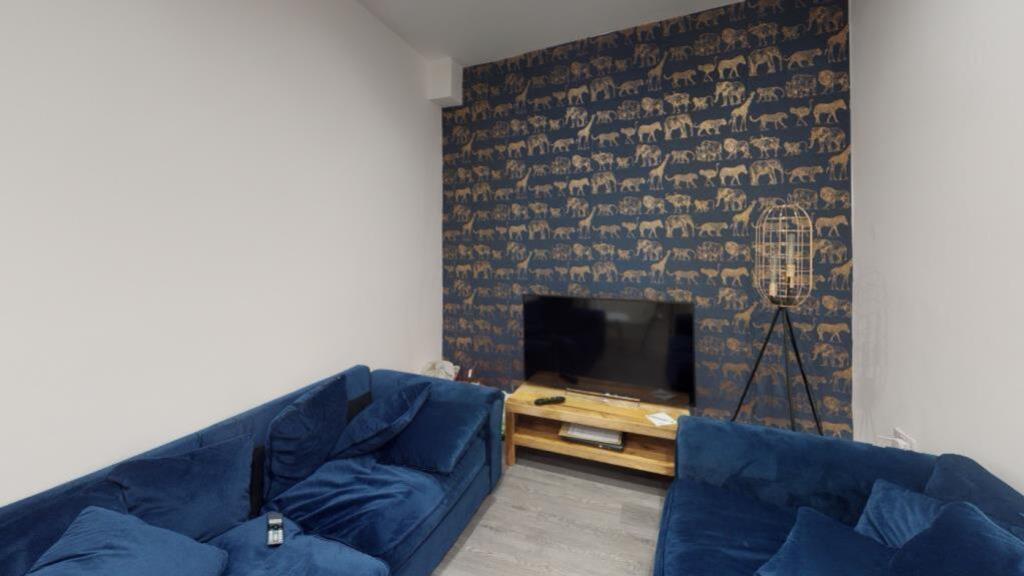 A stylish and spacious modern living room featu...