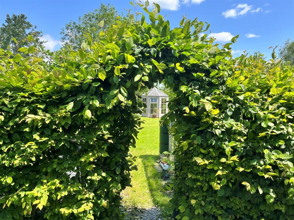 Summer house through Hedge.jpg