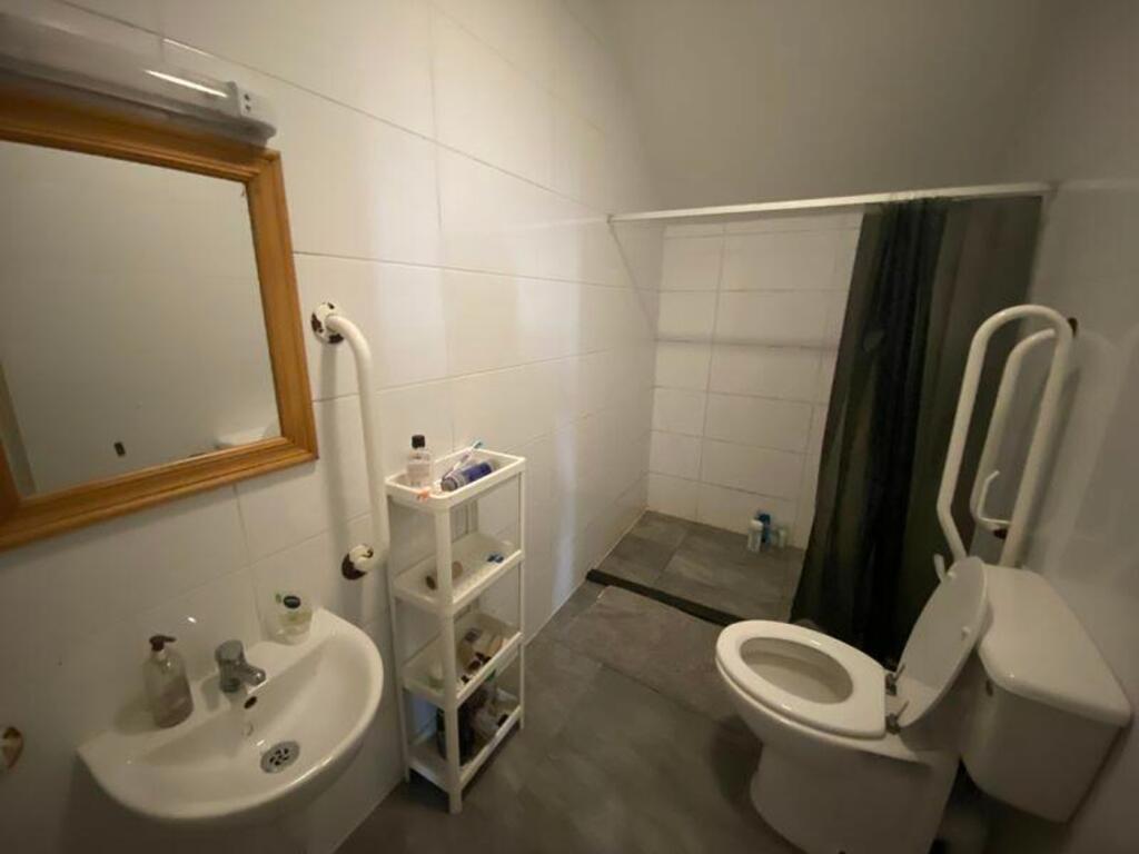 A clean and functional bathroom featuring moder...