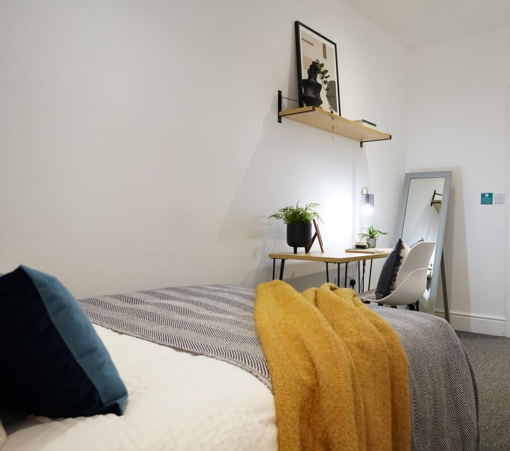A beautifully designed double bedroom featuring...