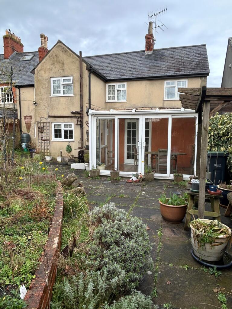 Rear garden with conservatory