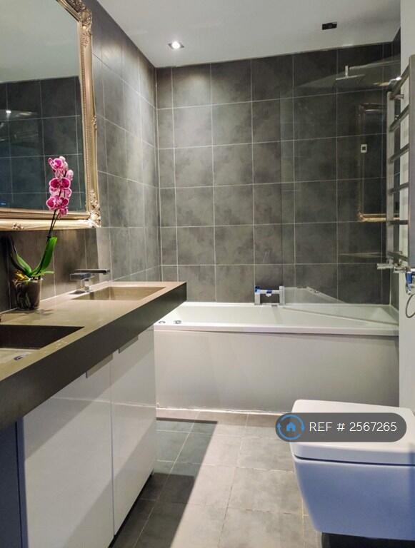 Upstairs Bathroom With a Shower