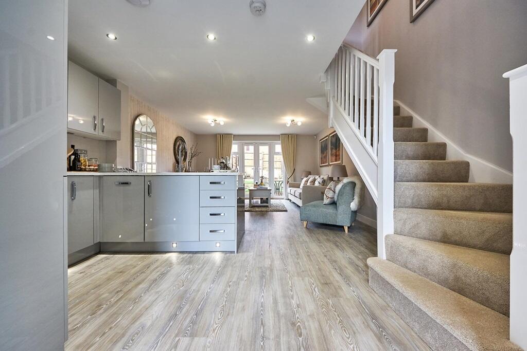 A welcoming hallway leads into the kitchen