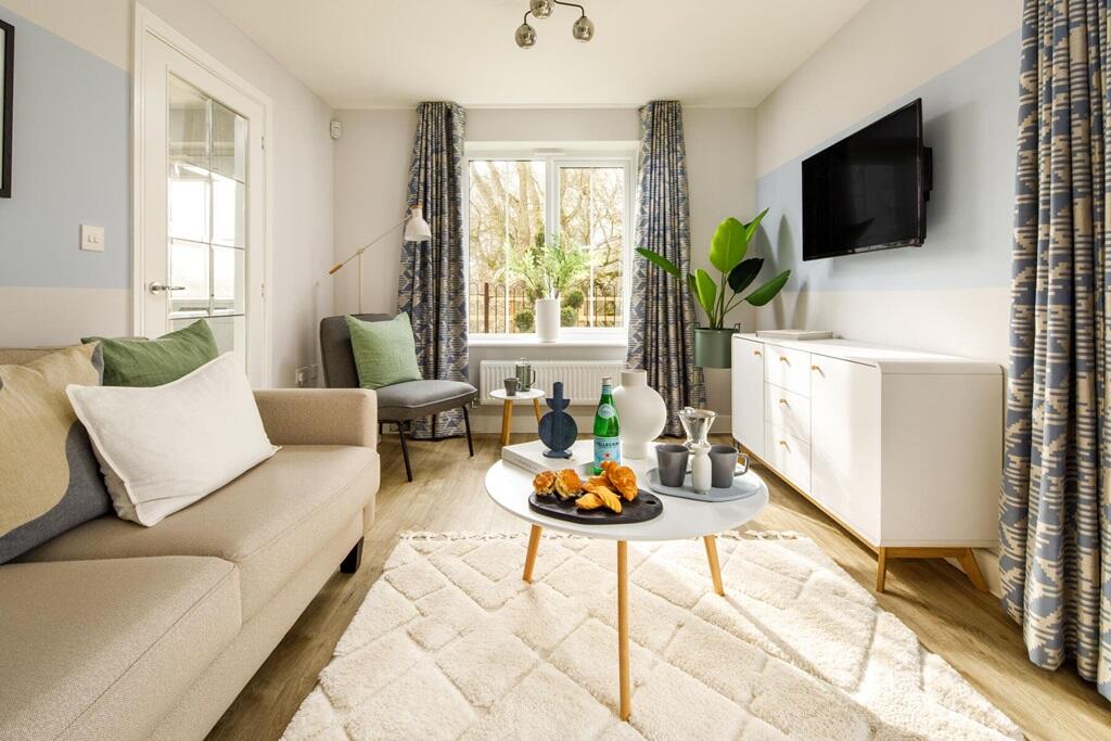 The lounge is flooded with natural light from both windows