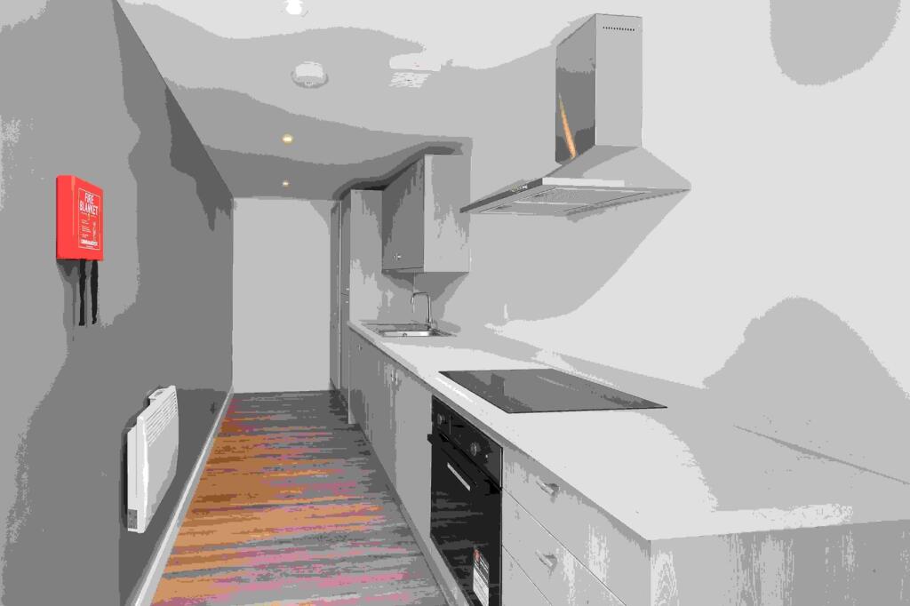 A modern and tidy kitchenette with stylish fini...