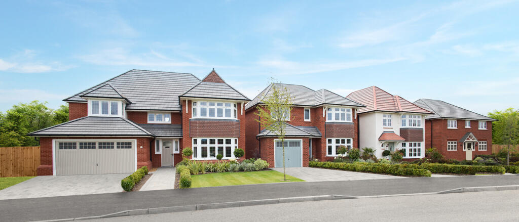 A row of modern detached houses with brick and white exteriors, bay windows, and neatly maintained f
