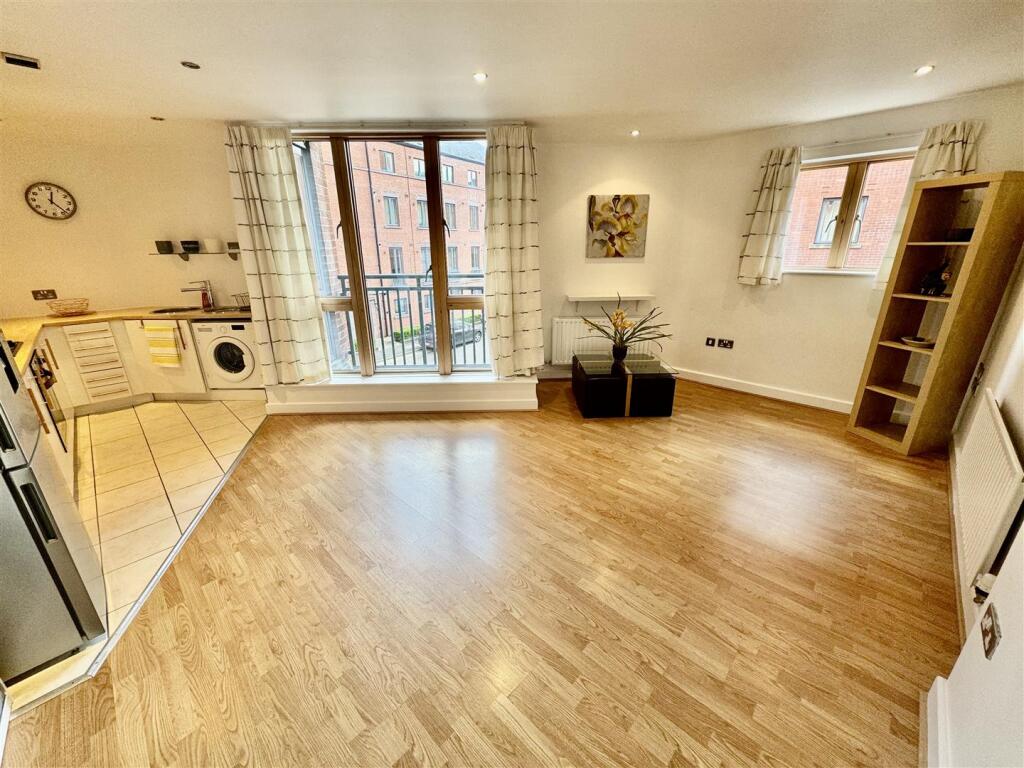 OPEN PLAN LIVING ROOM AND KITCHEN`