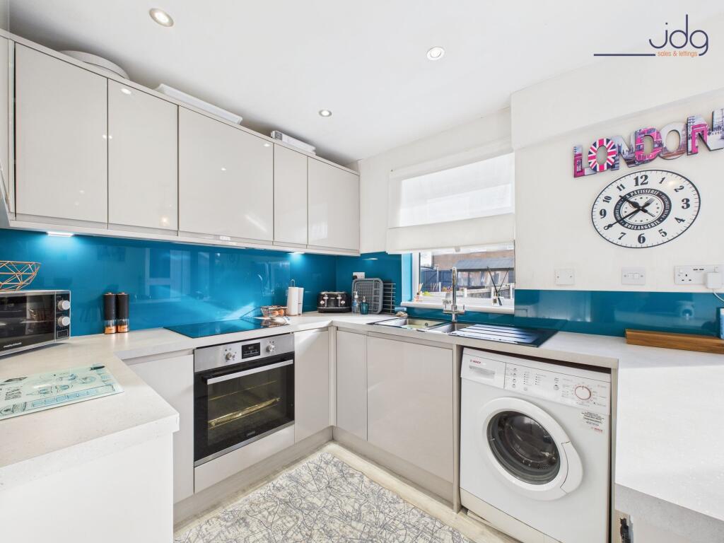 Open Plan Kitchen Diner with Breakfast Bar and bi-folding doors