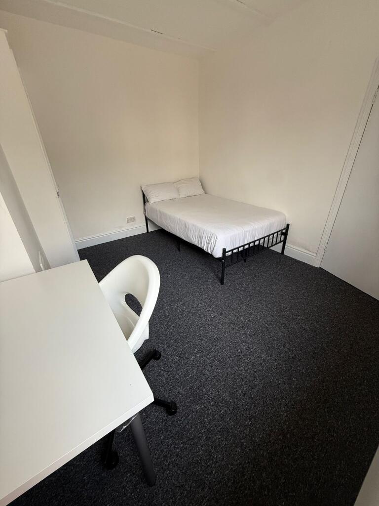 This inviting double bedroom features ample spa...