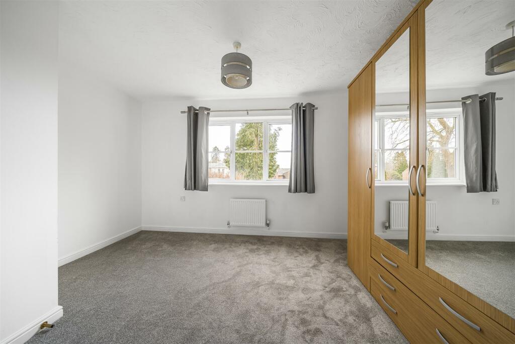 Bedroom 2 with wardrobes.jpg