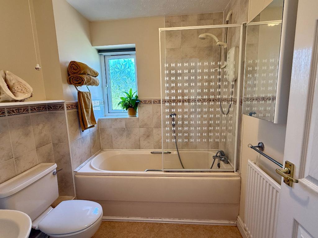 Family bathroom with overhead shower
