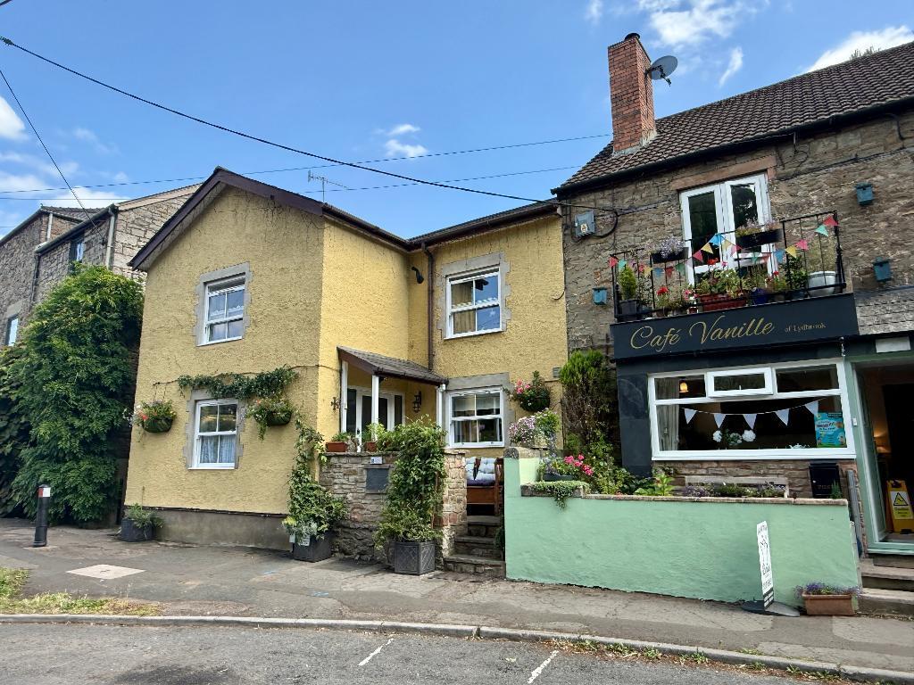 Wobage Cottage is the yellow house.