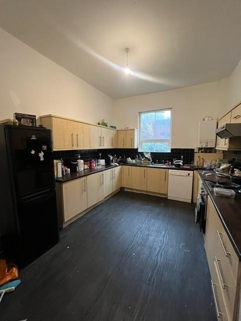 A spacious and well-maintained kitchen with amp...