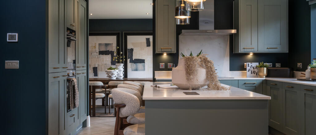 The Richmond interior kitchen area with island unit and view of the dining room in the background