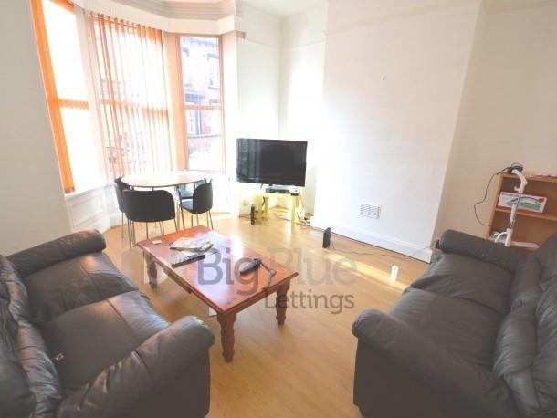 Bright and inviting living room featuring comfo...