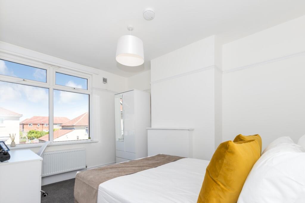 Bright and inviting double bedroom featuring am...