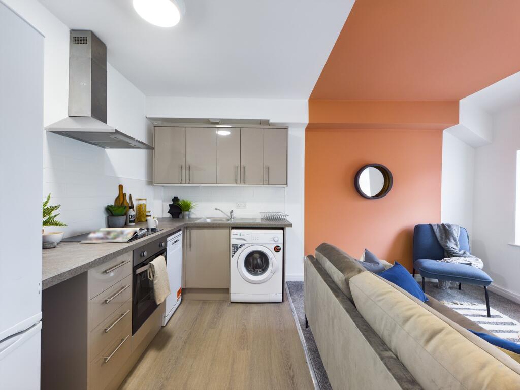 A stylish and well-equipped kitchenette with mo...