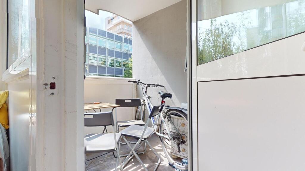 A bright and inviting outdoor balcony area with...