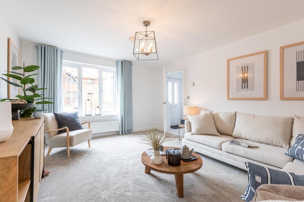 A large front window floods the lounge with natural light