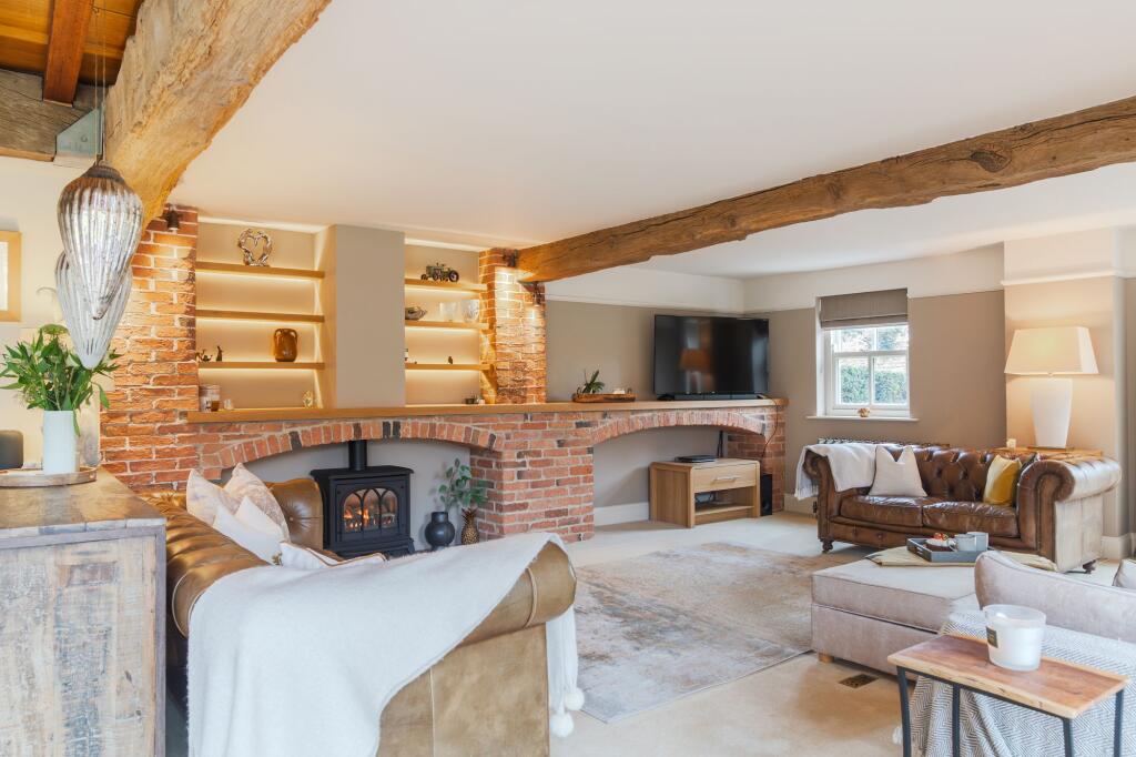 Cosy lounge with exposed brick and gas fire