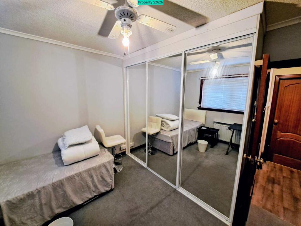 Bedroom showing mirrored wardrobes