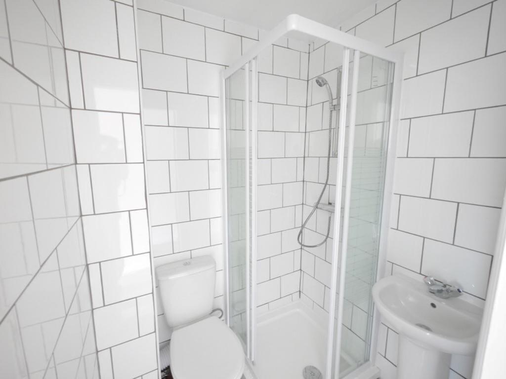 Bright and clean bathroom featuring a modern co...