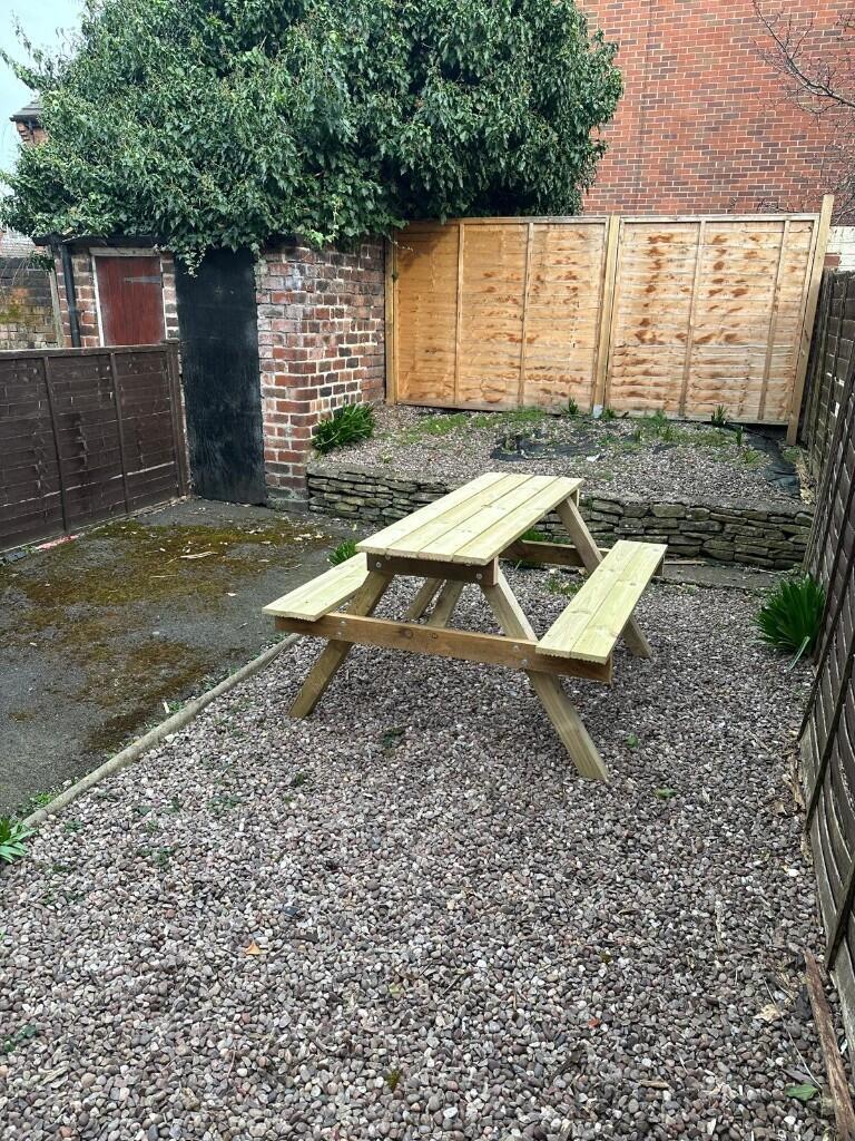 A peaceful and private garden area featuring a ...