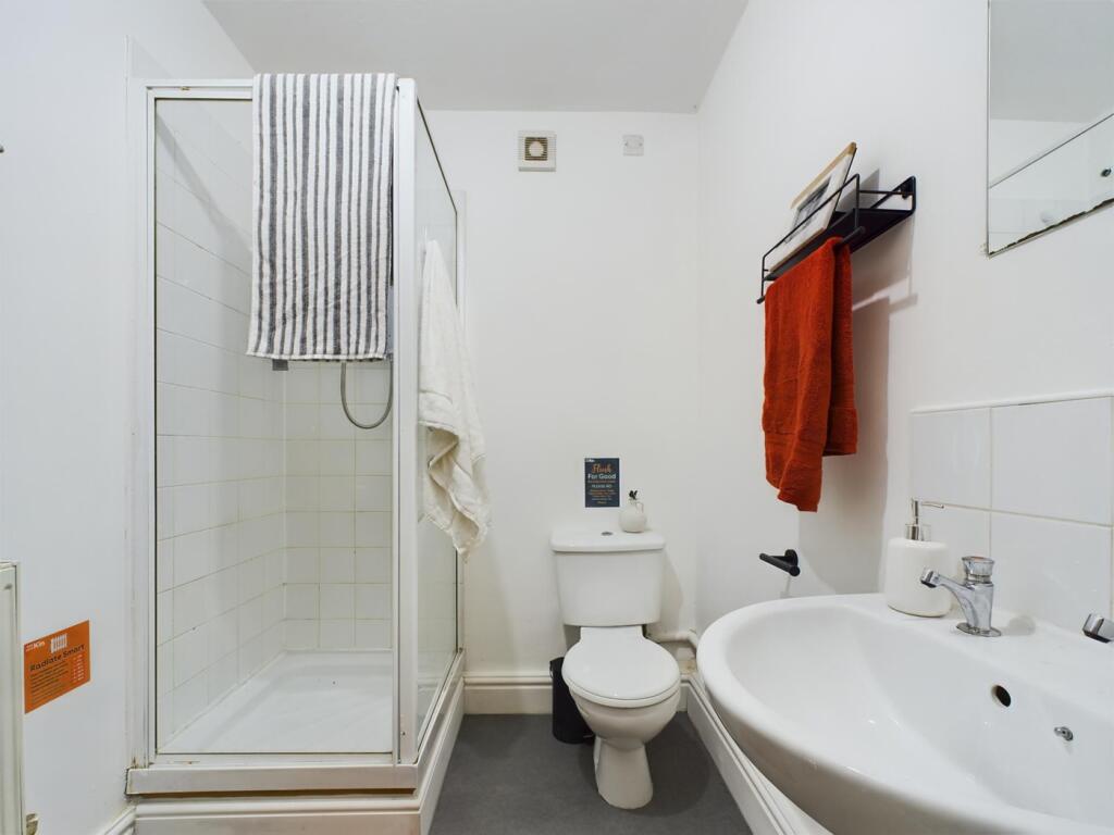 A bright and modern bathroom featuring a clean ...