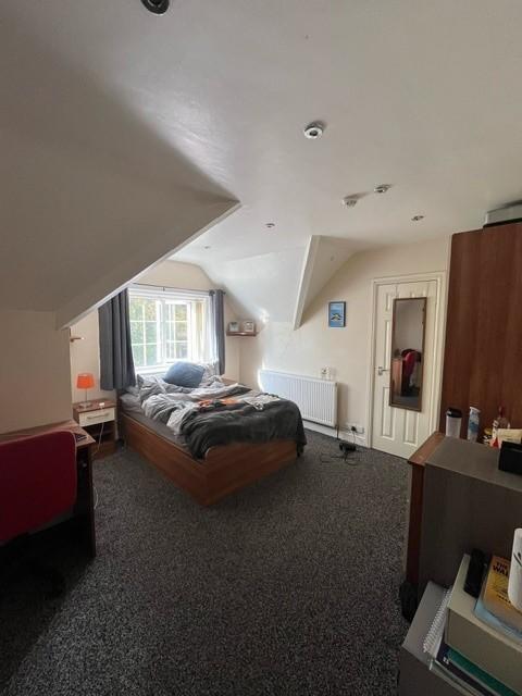 Bright, well-appointed bedroom with a double be...