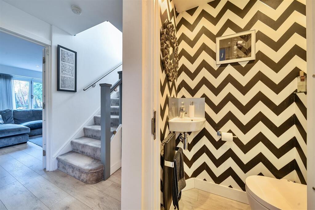 Entrance Hall/Guest Cloakroom: