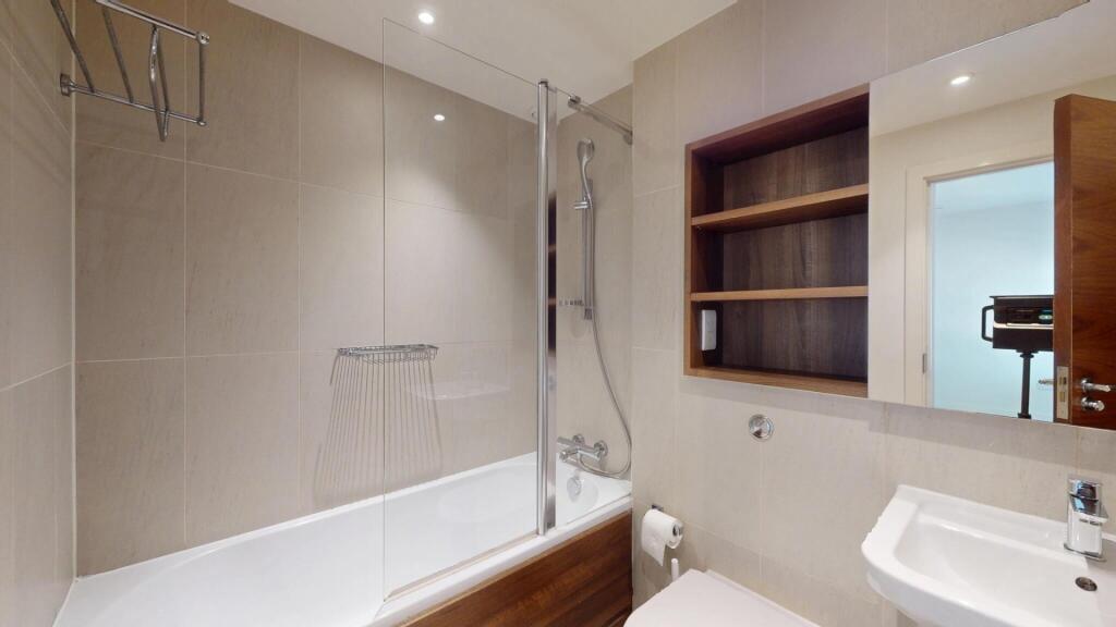 A modern and well-maintained bathroom featuring...