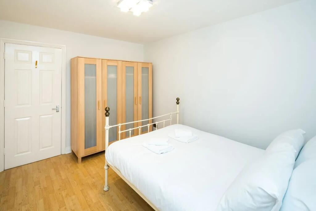 Bright and clean double bedroom featuring a sty...