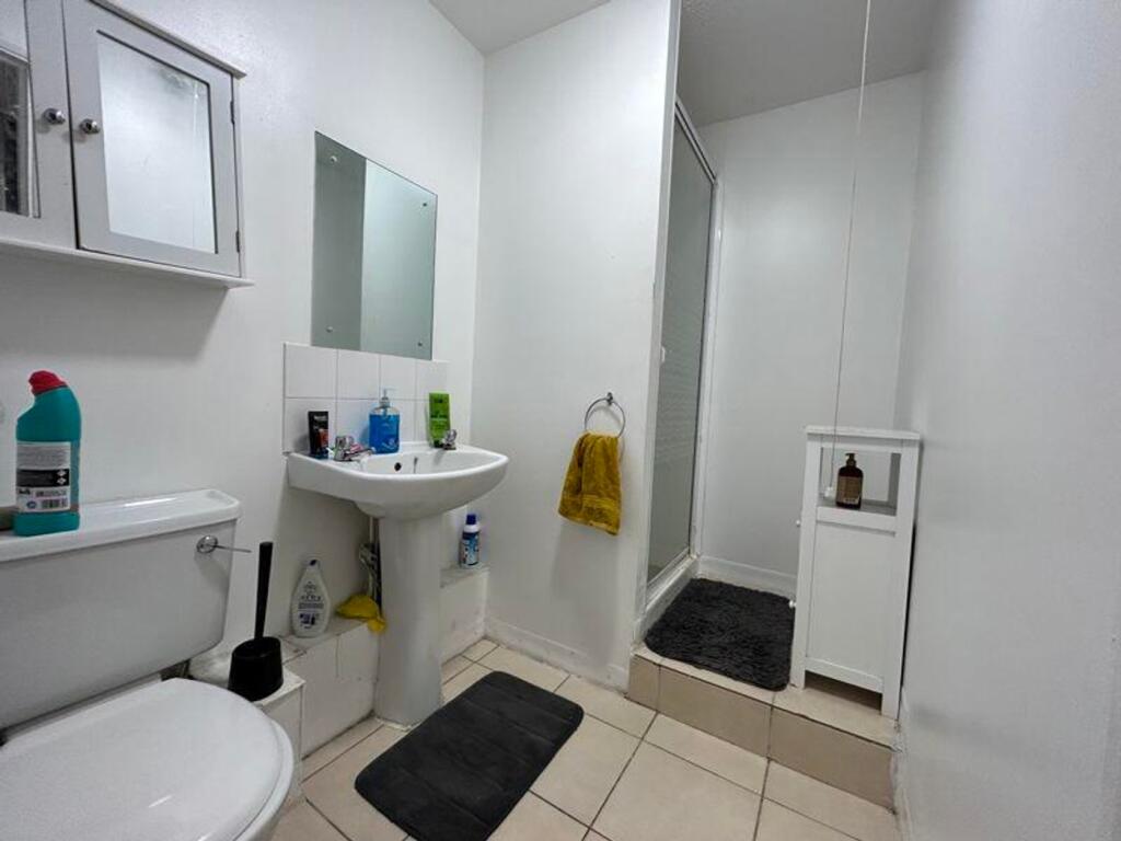 A bright and tidy bathroom featuring modern fix...