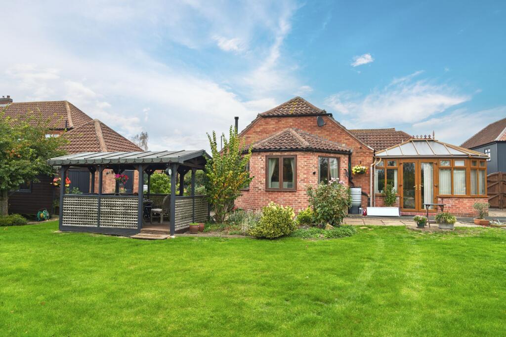Secure rear garden with summerhouse and Pergola