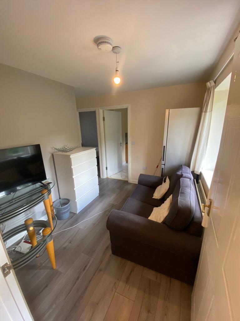 A cozy living room featuring a comfortable sofa...