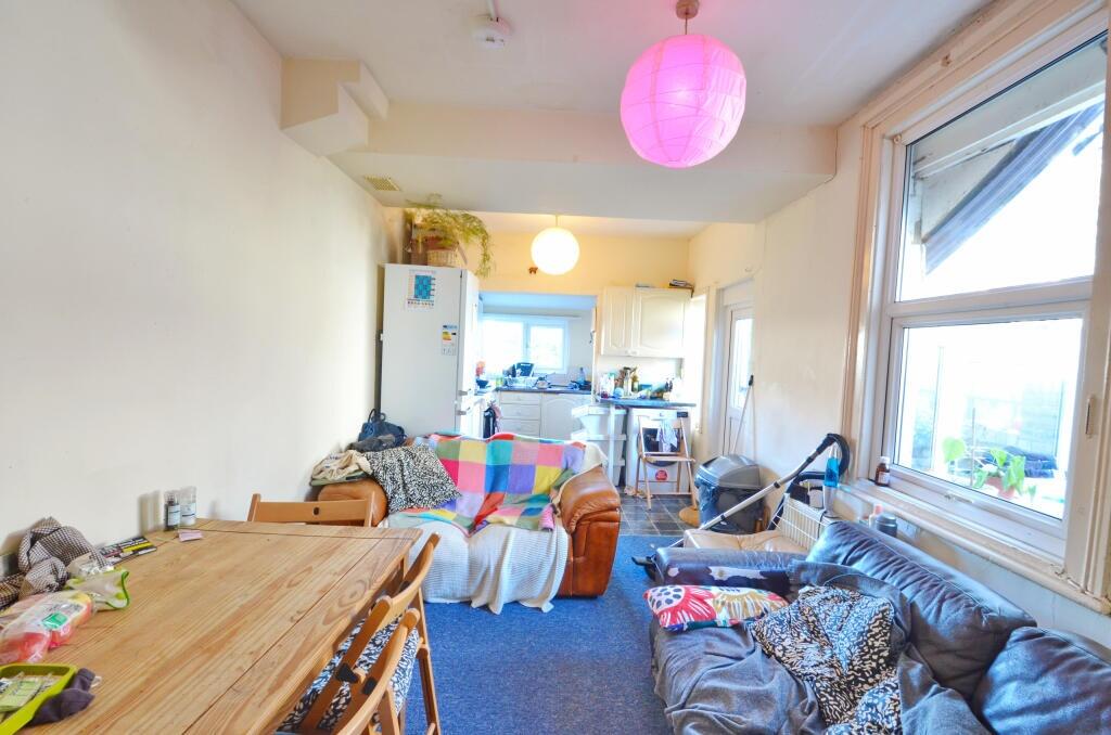 Bright and welcoming living room with large win...