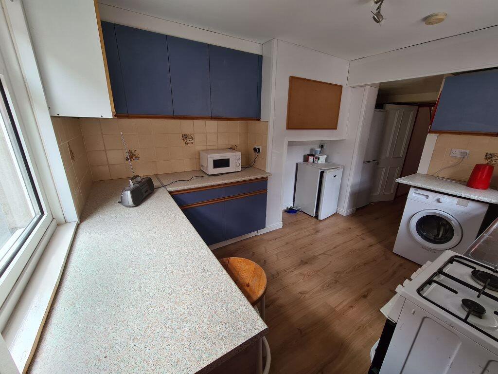 Bright and practical kitchen featuring ample co...