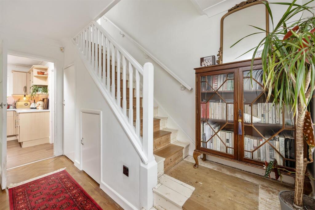 Stairs rising to First Floor