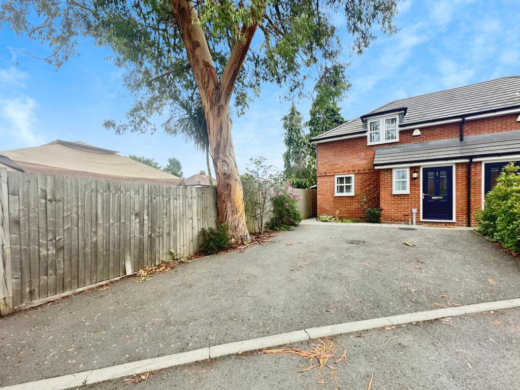 Outside View Of The Property With Driveway Parking