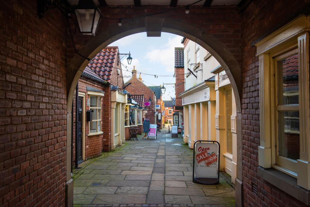 Quaint street view of local shops in Harworth