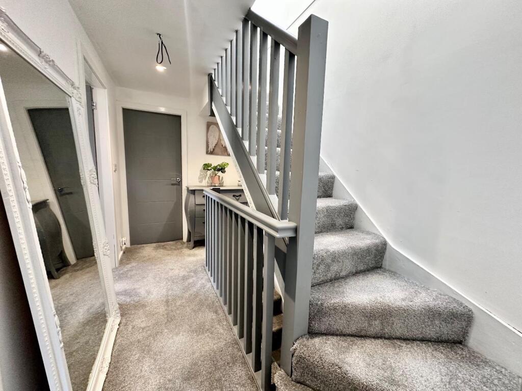 TO THE FIRST FLOOR LANDING