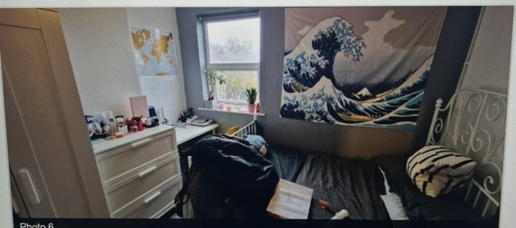 A cozy double bedroom featuring vibrant decor a...