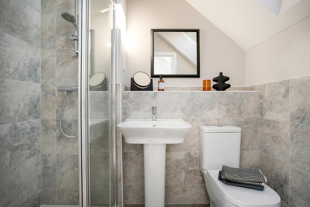 En-suite shower room away from the family