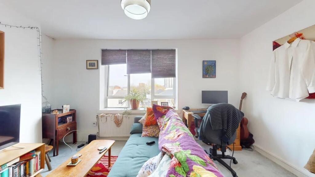 Bright and inviting living room featuring a com...