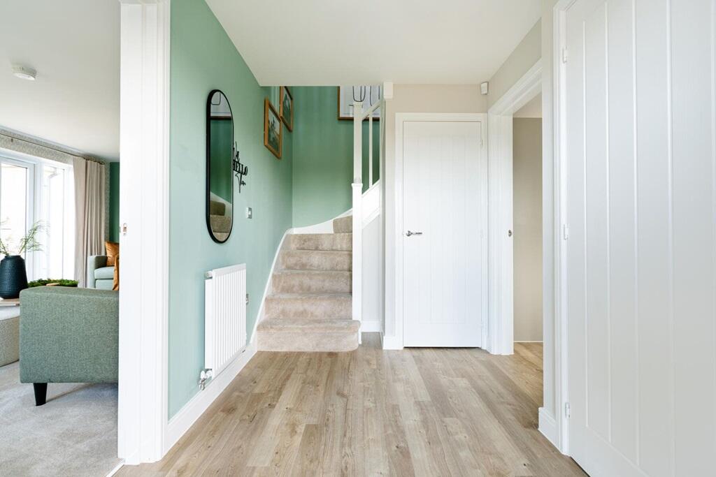 Spacious hallway with under stairs storage